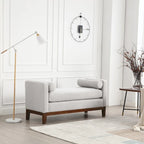 Banc/pouf élégant de 53,5 cm de large, capitonné, avec pieds en bois et coussins cylindriques, idéal pour le pied de lit, la chambre, le salon ou l'entrée.