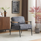 Fauteuil d'appoint moderne avec coussins moelleux, structure métallique minimaliste et accoudoirs en bois.