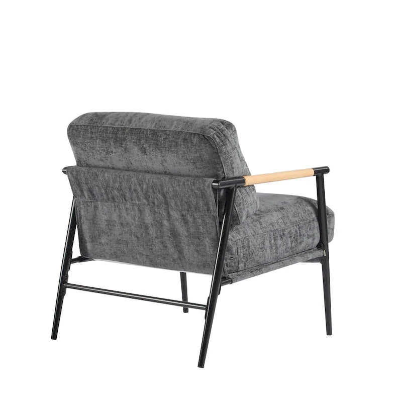 Fauteuil d'appoint moderne avec coussins moelleux, structure métallique minimaliste et accoudoirs en bois.
