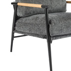 Fauteuil d'appoint moderne avec coussins moelleux, structure métallique minimaliste et accoudoirs en bois.