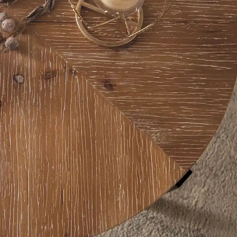 Table basse ronde moderne rétro avec plateau en bois de sapin et piètement croisé noir, idéale pour le salon.