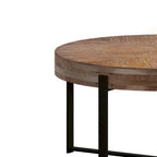 Table basse ronde moderne rétro avec plateau en bois de sapin et piètement croisé noir, idéale pour le salon.