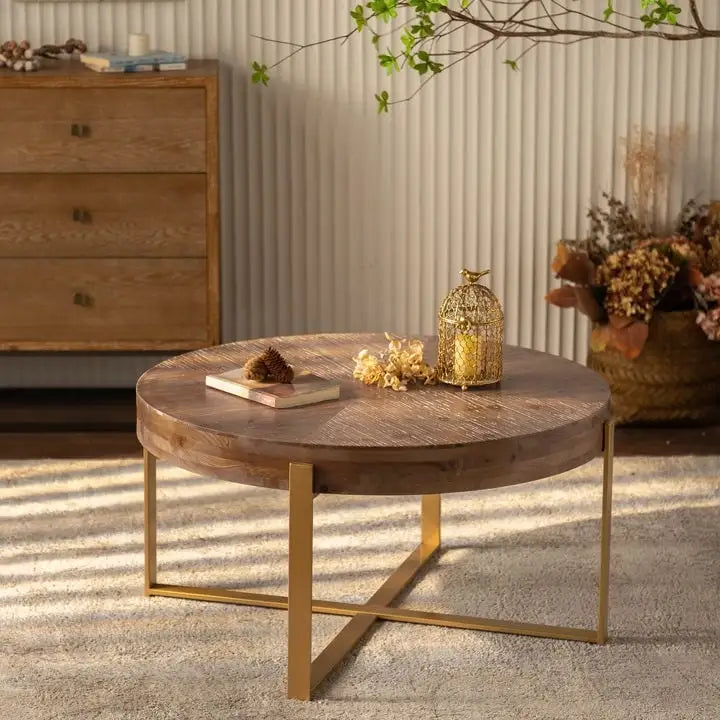 Table basse ronde moderne rétro avec plateau en bois de sapin et piètement croisé noir, idéale pour le salon.