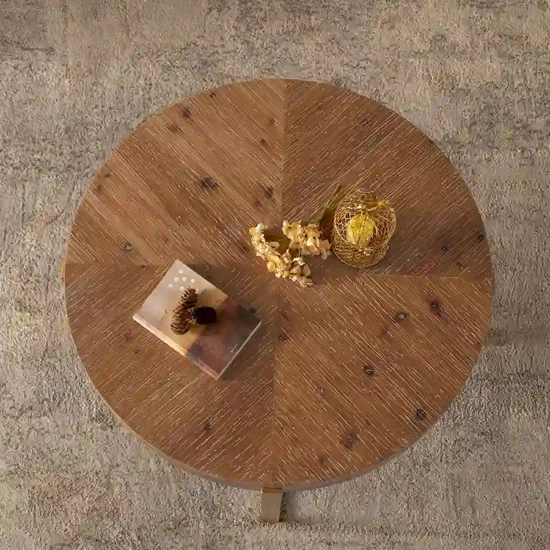 Table basse ronde moderne rétro avec plateau en bois de sapin et piètement croisé noir, idéale pour le salon.