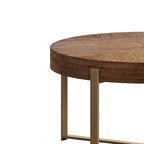 Table basse ronde moderne rétro avec plateau en bois de sapin et piètement croisé noir, idéale pour le salon.