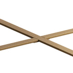 Table basse ronde moderne rétro avec plateau en bois de sapin et piètement croisé noir, idéale pour le salon.