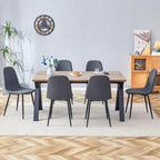 Ensemble de salle à manger moderne avec table rectangulaire noire en forme de A et chaises à dossier rond