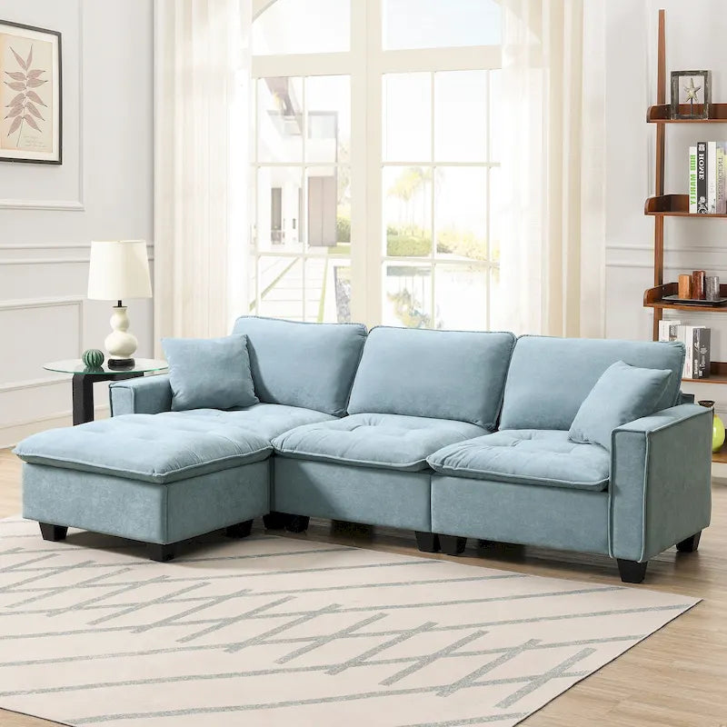 Canapé d'angle convertible 4 places en forme de L bleu 100 avec pouf amovible et coussins assortis, idéal pour le salon