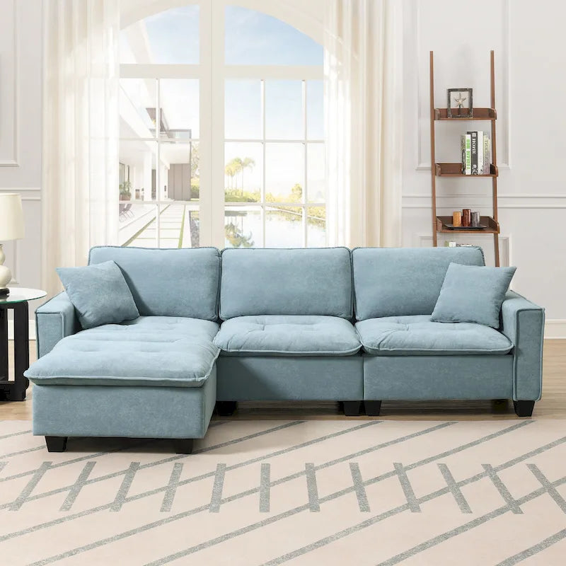 Canapé d'angle convertible 4 places en forme de L bleu 100 avec pouf amovible et coussins assortis, idéal pour le salon