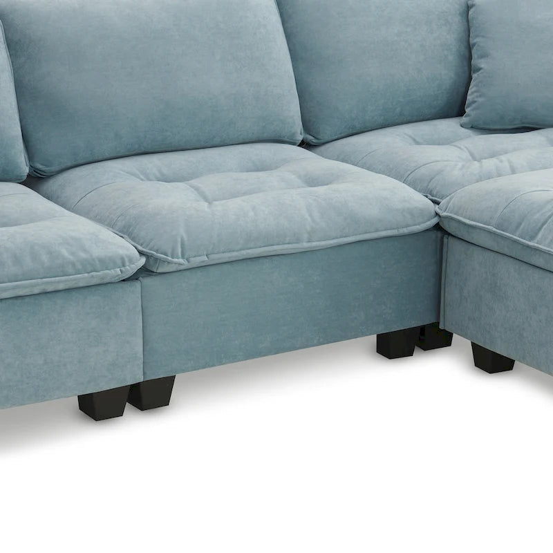 Canapé d'angle convertible 4 places en forme de L bleu 100 avec pouf amovible et coussins assortis, idéal pour le salon