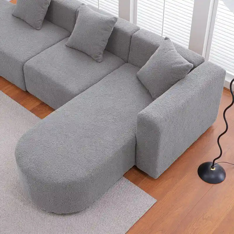 Canapé d'angle moderne en bouclette avec assise incurvée (orienté à droite)