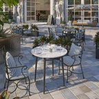 Table de salle à manger ronde avec plateau en marbre et pieds en métal, idéale pour la salle à manger ou la cuisine.