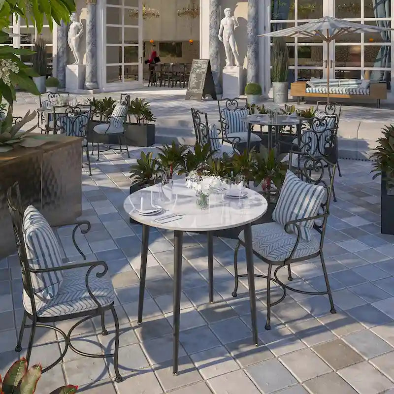 Table de salle à manger ronde avec plateau en marbre et pieds en métal, idéale pour la salle à manger ou la cuisine.