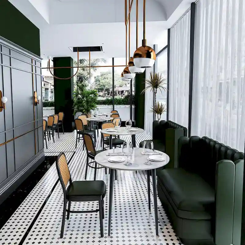 Table de salle à manger ronde avec plateau en marbre et pieds en métal, idéale pour la salle à manger ou la cuisine.