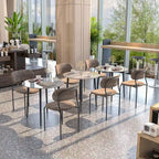 Table de salle à manger ronde avec plateau en marbre et pieds en métal, idéale pour la salle à manger ou la cuisine.