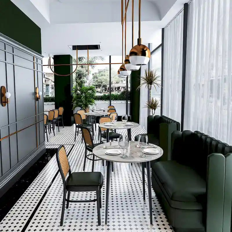 Table de salle à manger ronde avec plateau en marbre et pieds en métal, idéale pour la salle à manger ou la cuisine.